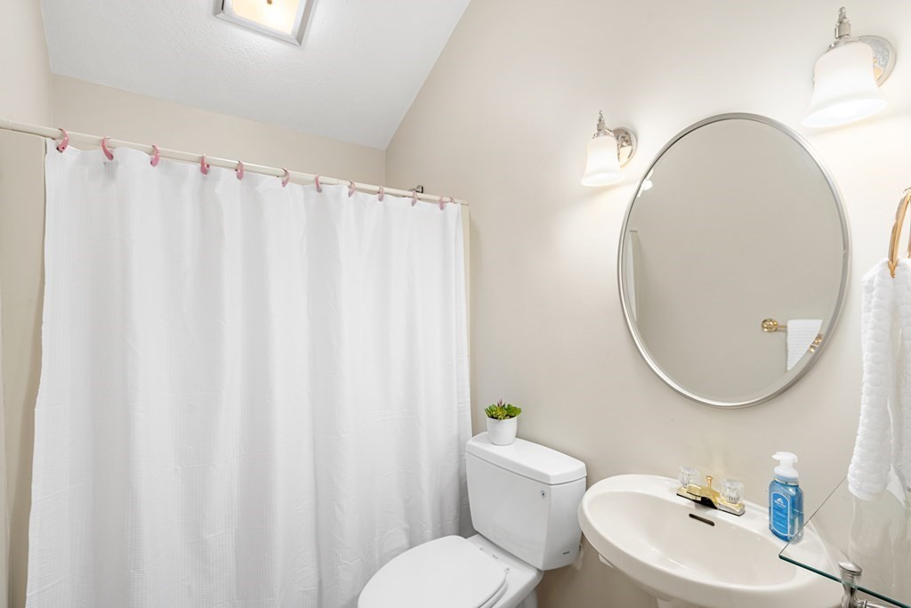 93 Gayland Road Needham, MA 02492 - Photo 16 of 36 a bathroom with a toilet a sink and a mirror