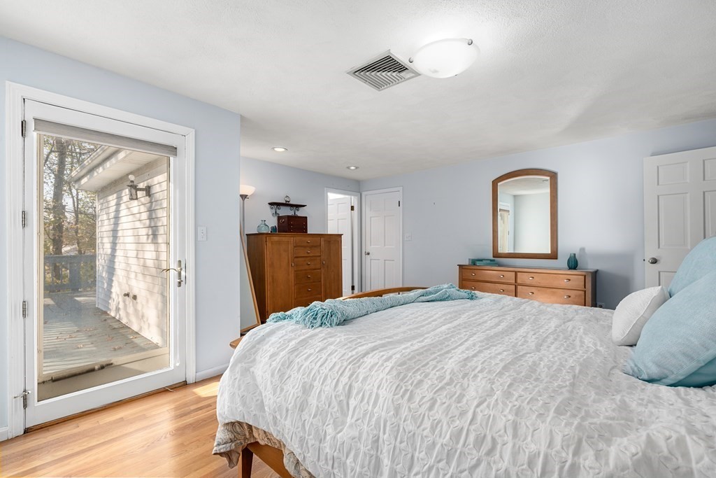 93 Gayland Road Needham, MA 02492 - Photo 18 of 36 a bedroom with a bed and a mirror