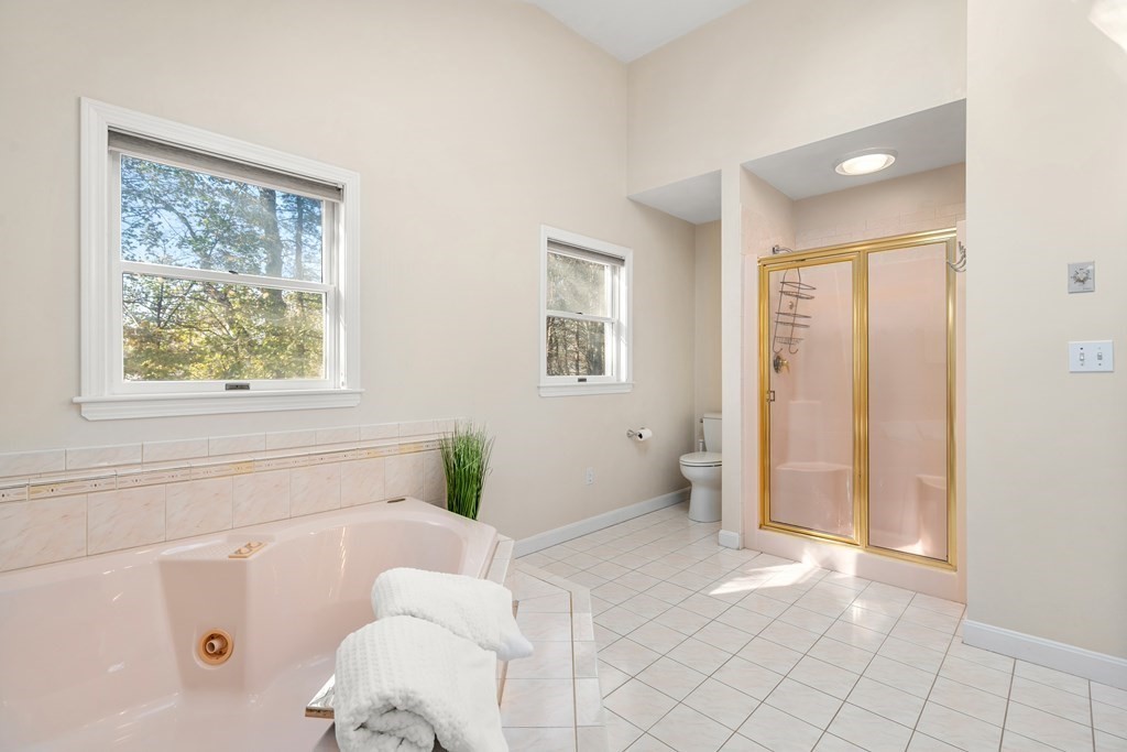 93 Gayland Road Needham, MA 02492 - Photo 21 of 36 a bathroom with a bathtub and a shower