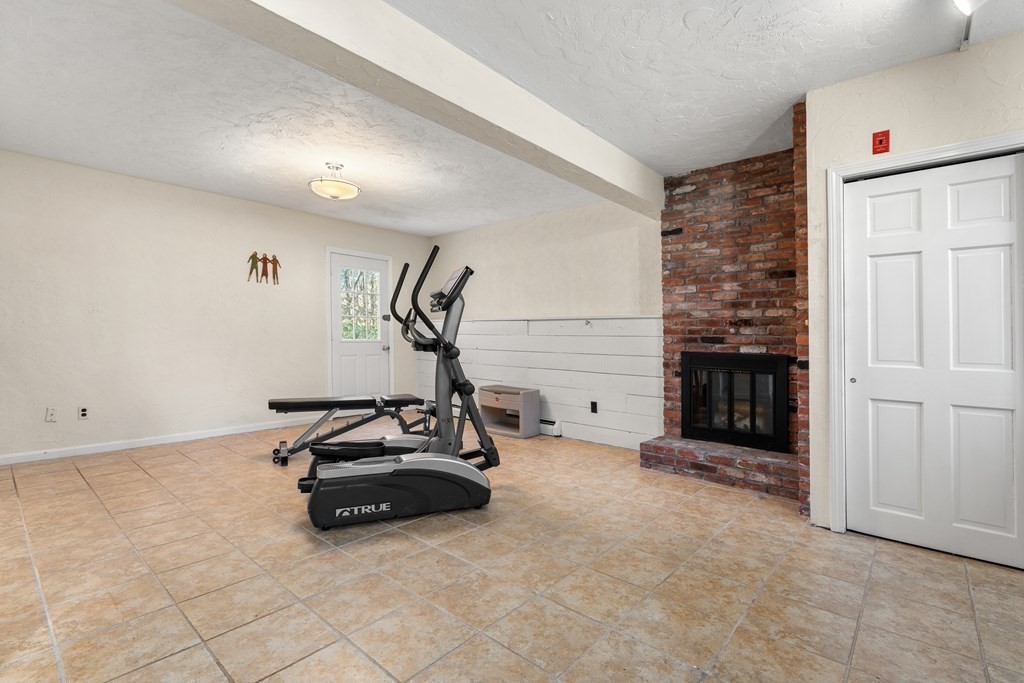 93 Gayland Road Needham, MA 02492 - Photo 23 of 36 a room with gym equipment