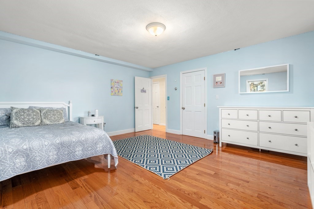 93 Gayland Road Needham, MA 02492 - Photo 28 of 36 a bedroom with a bed and a dresser