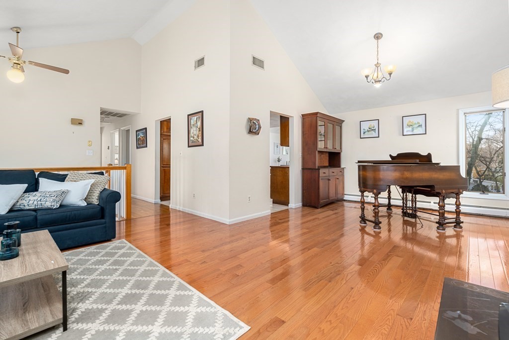 93 Gayland Road Needham, MA 02492 - Photo 6 of 36 a living room with furniture and a dining table