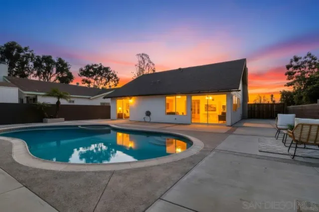 a view of swimming pool with seating space