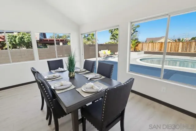 a view of a dining room with furniture window and outside view