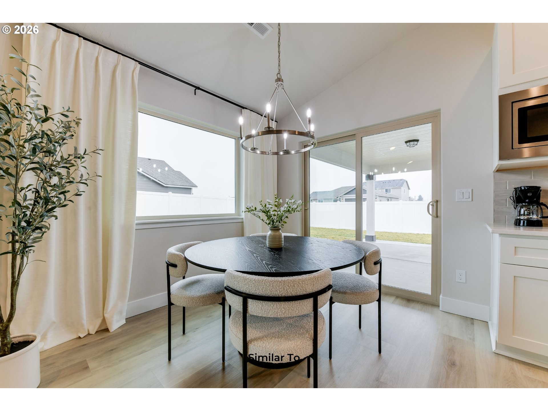227 Southwest Goldfinch Lane Boardman, OR 97818 - Photo 10 of 28 a view of a dining room with furniture and wooden floor