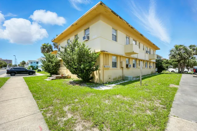 a view of a cars parked in front of a house