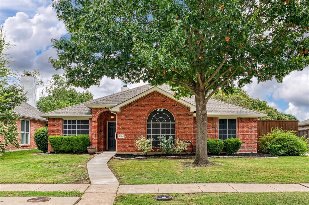 8104 Sebastian Frisco, TX 75035 - Photo 1 of 1 a front view of a house with a garden
