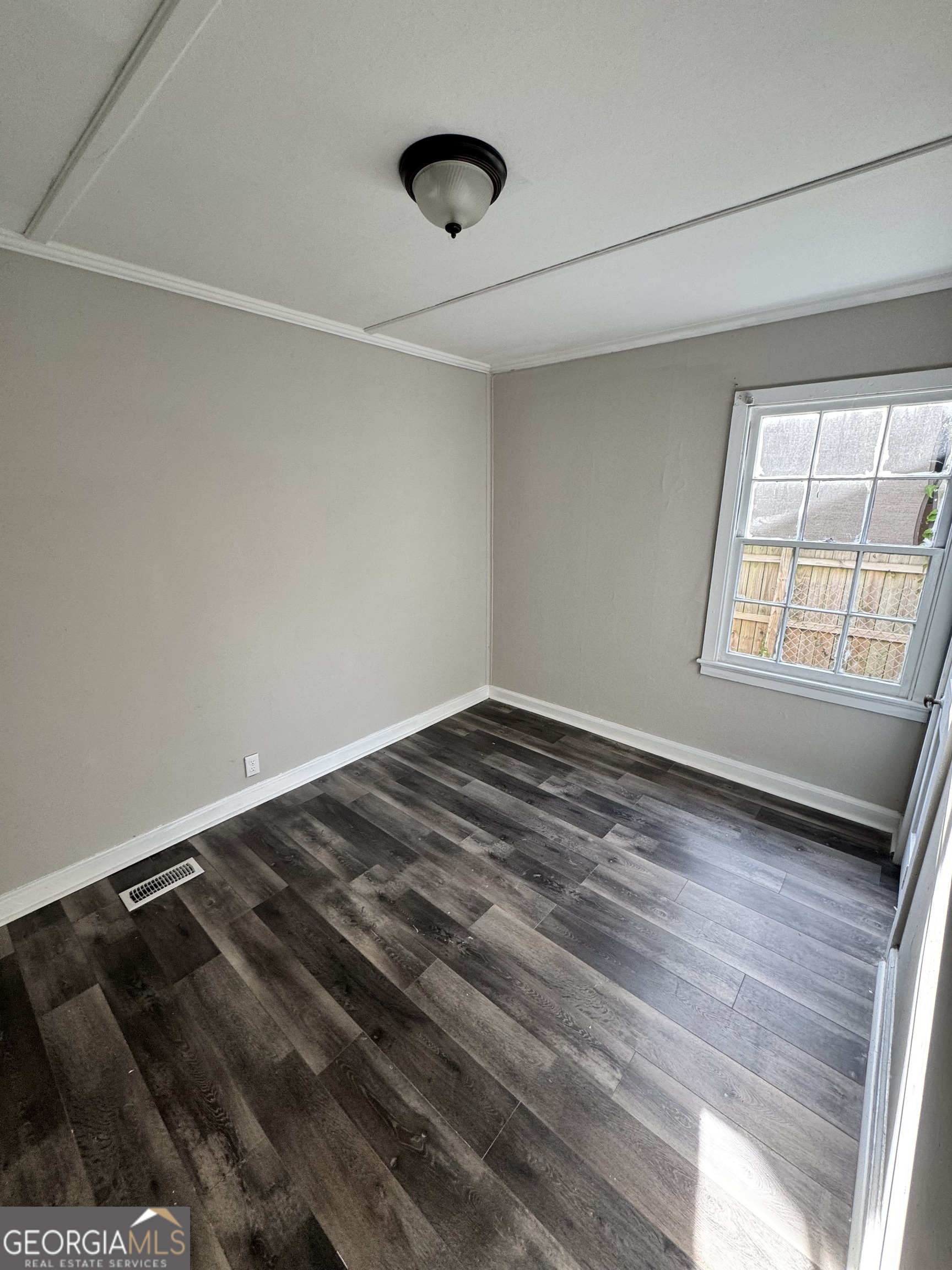 1282 Hartley Street Macon, GA 31206 - Photo 13 of 15 a view of an empty room and window