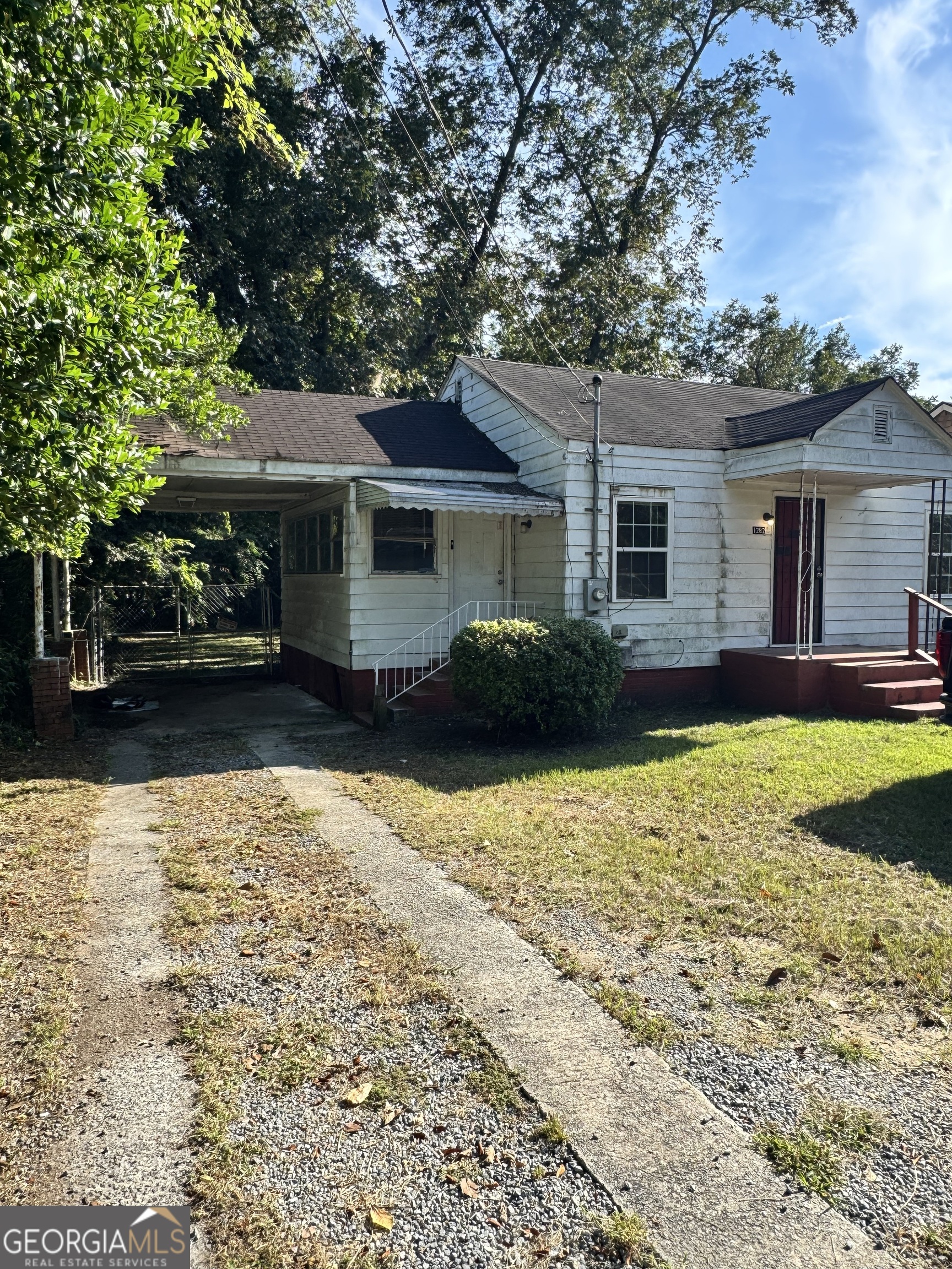 1282 Hartley Street Macon, GA 31206 - Photo 2 of 15 front view of a house with a yard
