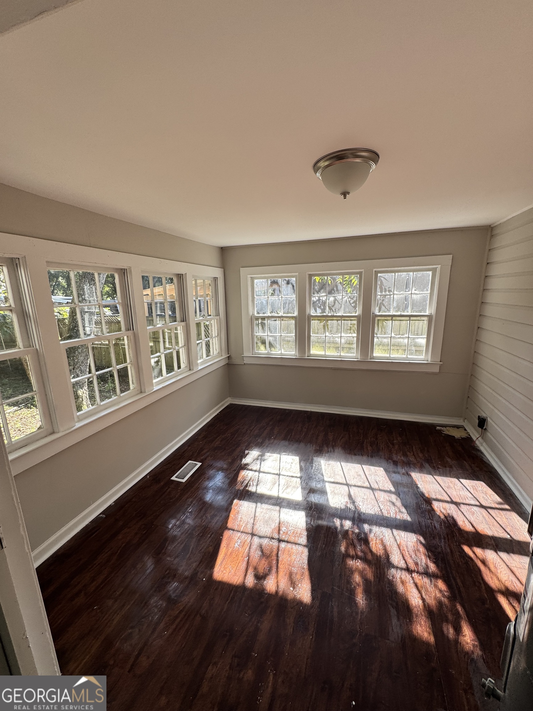 1282 Hartley Street Macon, GA 31206 - Photo 9 of 15 a view of an empty room with a window