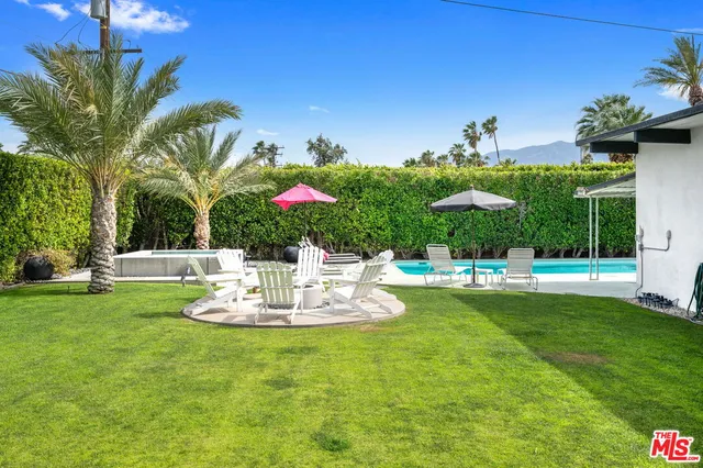 a view of a house with swimming pool garden and patio