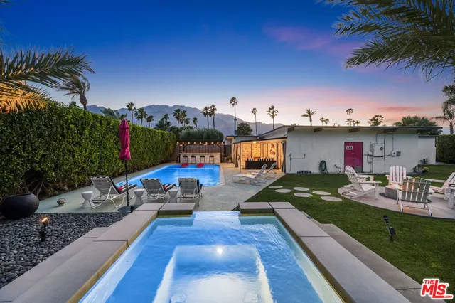 a view of a couches and lounge chairs in patio
