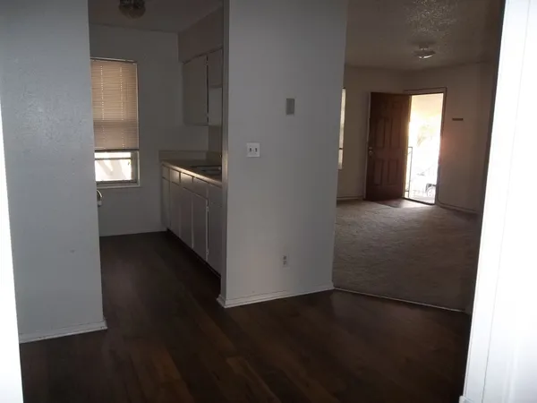 a kitchen with a refrigerator and a stove