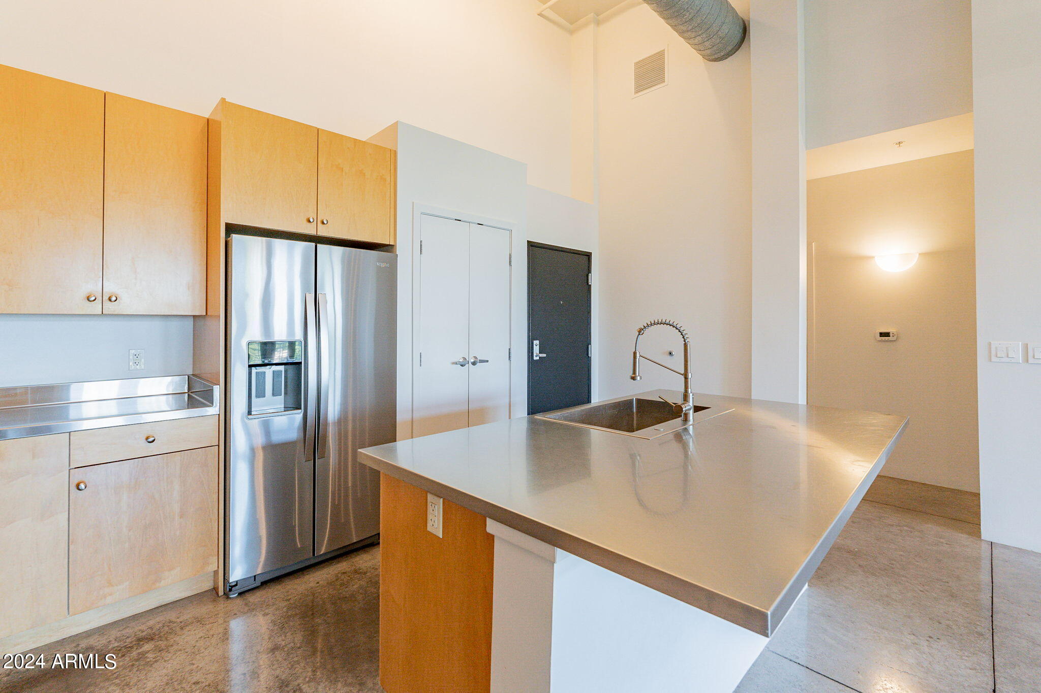 914 East Osborn Road, Unit 416 Phoenix, AZ 85014 - Photo 16 of 44 a view of a kitchen with a sink and refrigerator