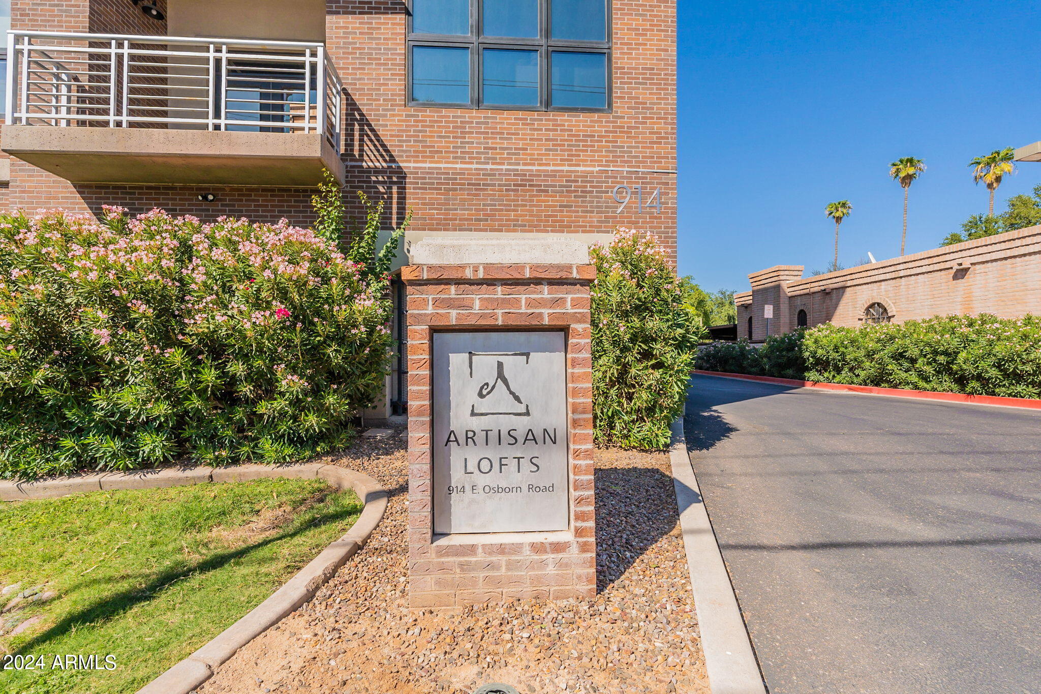 914 East Osborn Road, Unit 416 Phoenix, AZ 85014 - Photo 2 of 44 a front view of a house with a garden