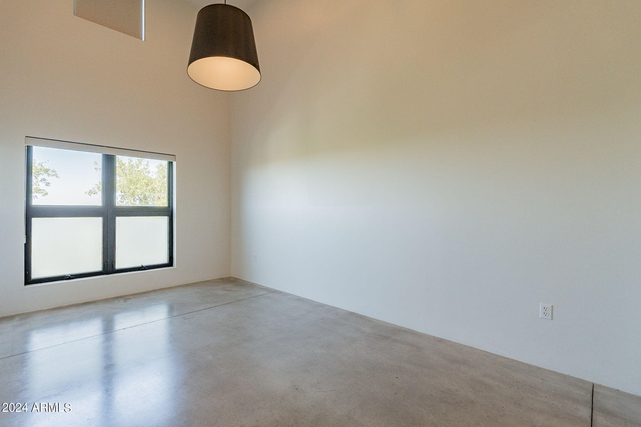 914 East Osborn Road, Unit 416 Phoenix, AZ 85014 - Photo 25 of 44 an empty room with windows