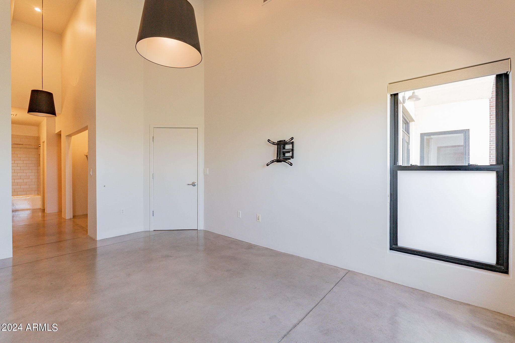 914 East Osborn Road, Unit 416 Phoenix, AZ 85014 - Photo 27 of 44 a view of empty room with wooden floor