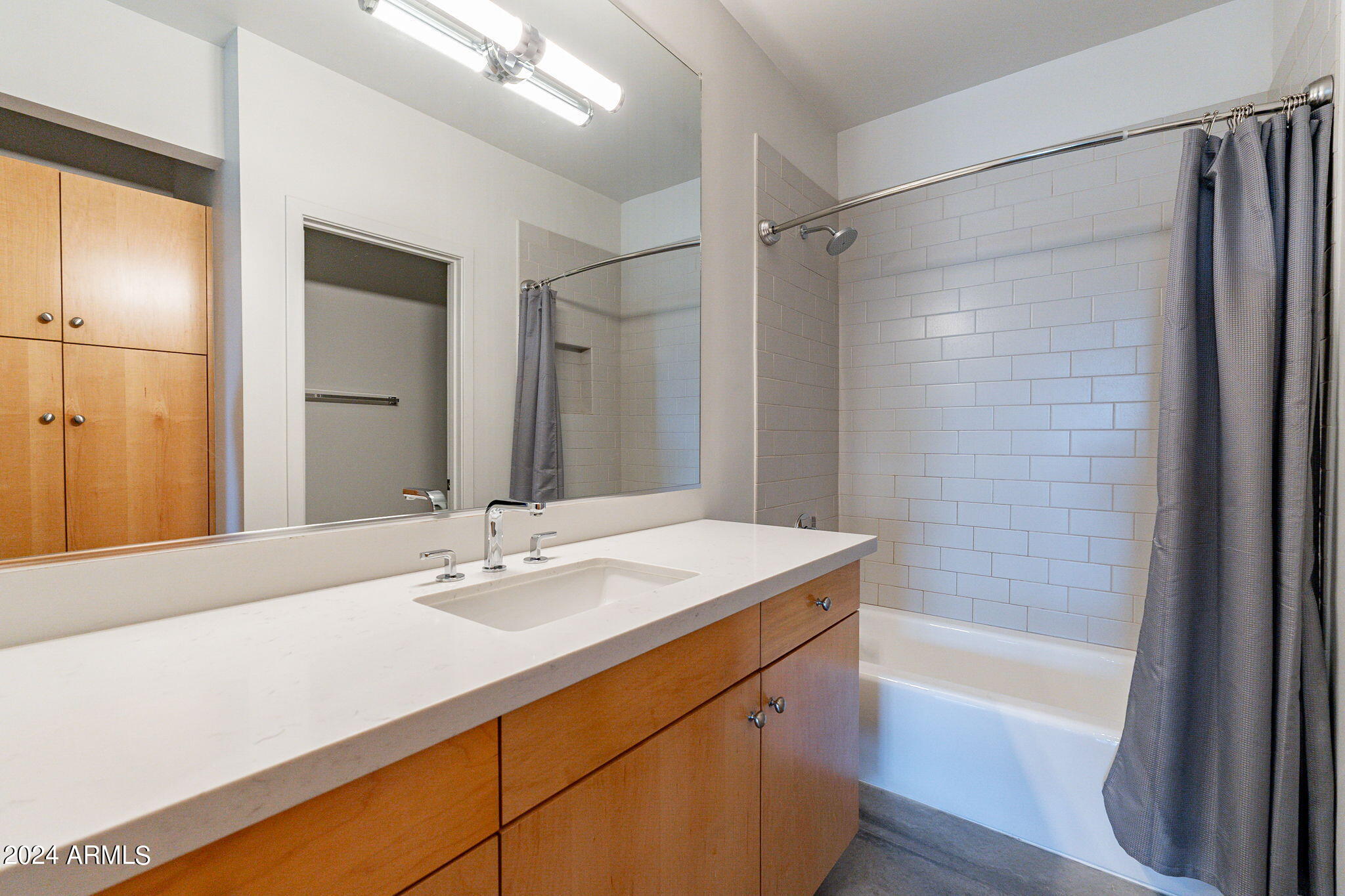 914 East Osborn Road, Unit 416 Phoenix, AZ 85014 - Photo 30 of 44 a bathroom with a sink double vanity and a bathtub