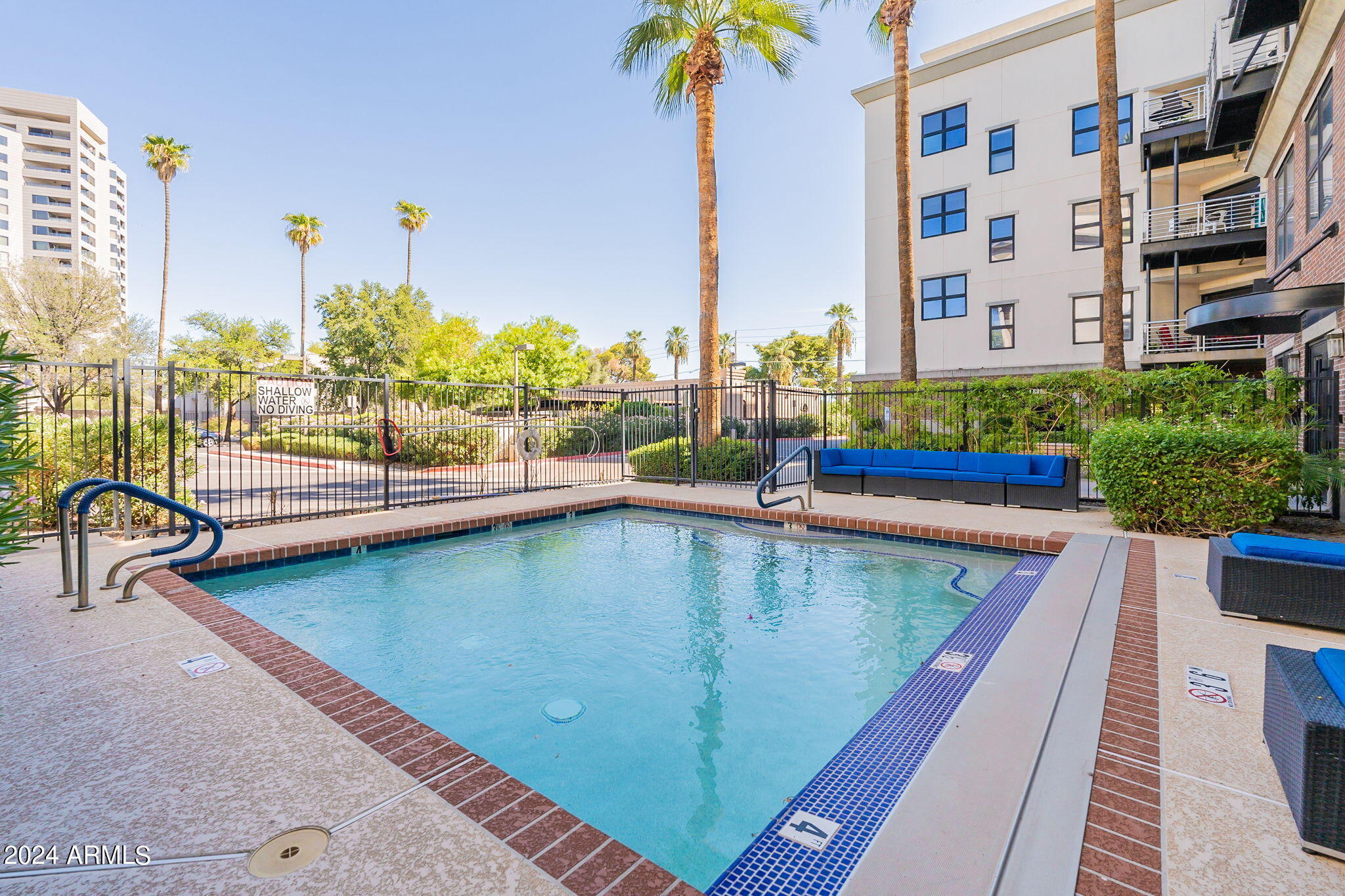 914 East Osborn Road, Unit 416 Phoenix, AZ 85014 - Photo 44 of 44 a view of swimming pool with outdoor seating