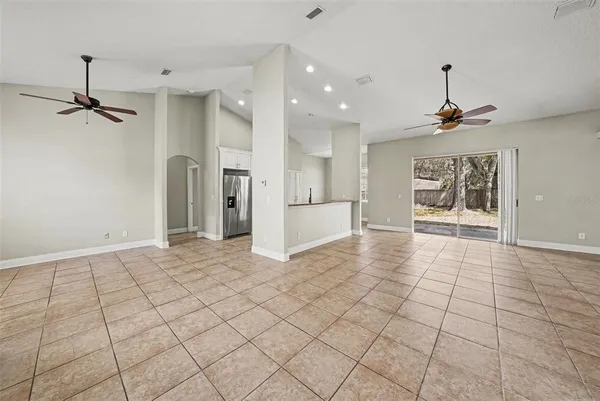 a view of an empty room and a window