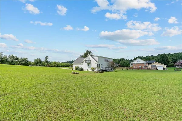 a picture of a bathroom with a white wall