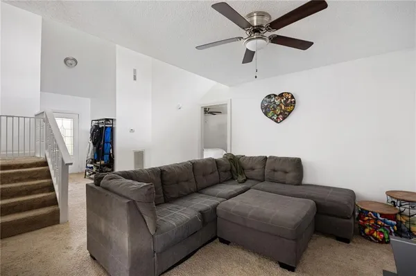 a kitchen with stainless steel appliances kitchen island wooden floors and white cabinets