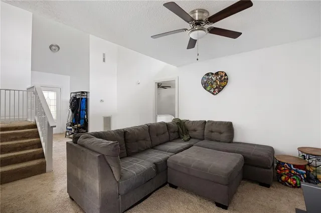 a kitchen with stainless steel appliances kitchen island wooden floors and white cabinets