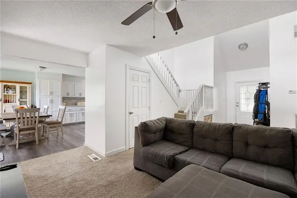 a dining room with furniture and window