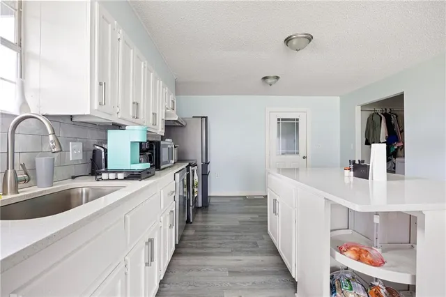 a bathroom with a toilet a sink and a window
