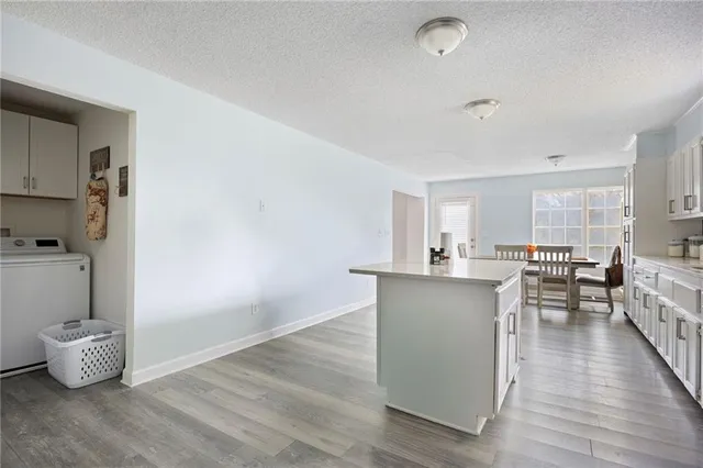 a bathroom with a toilet a sink a vanity and window