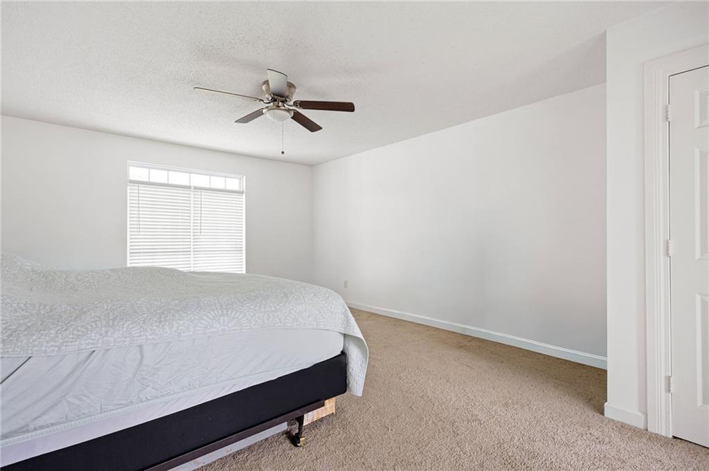 7 Herchel Mize Road Southwest Cave Spring, GA 30124 - Photo 35 of 58 a room with a bed and a window