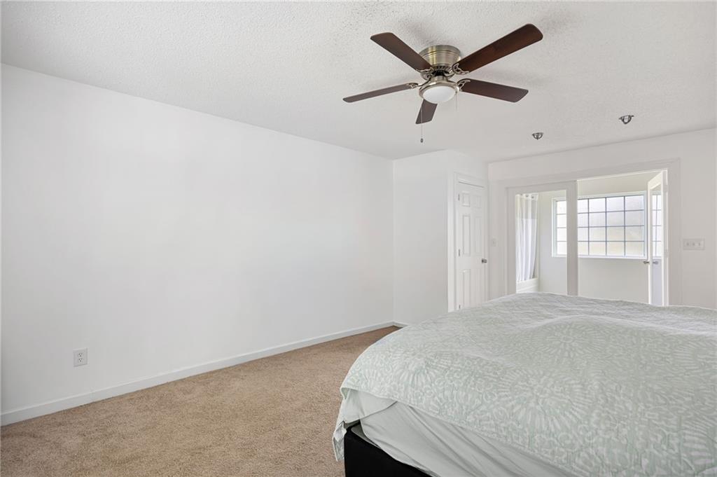 7 Herchel Mize Road Southwest Cave Spring, GA 30124 - Photo 36 of 58 a room with bed and ceiling fan