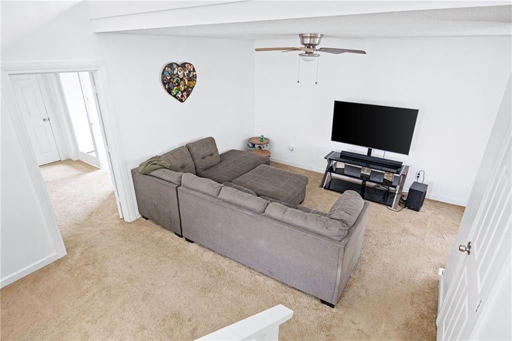 7 Herchel Mize Road Southwest Cave Spring, GA 30124 - Photo 41 of 58 a living room with furniture and a flat screen tv