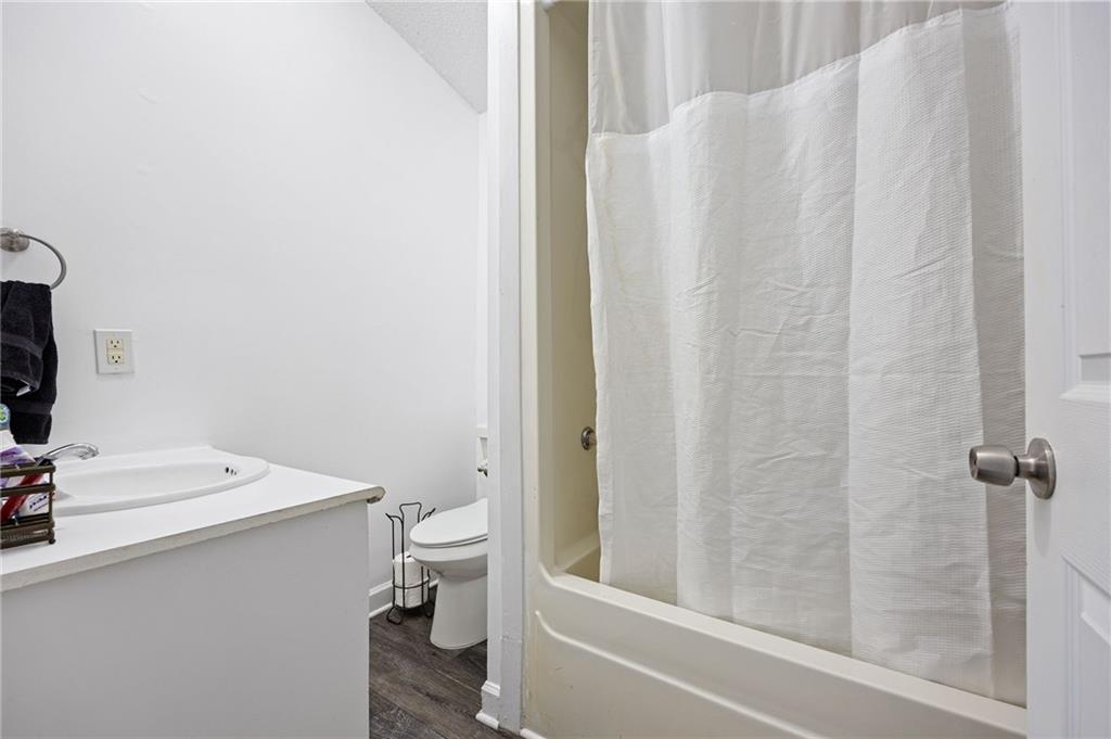 7 Herchel Mize Road Southwest Cave Spring, GA 30124 - Photo 46 of 58 a bathroom with a sink toilet and shower