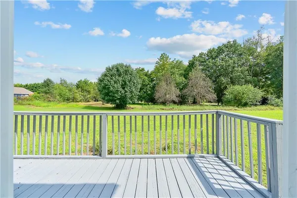 a view of balcony with wooden floor