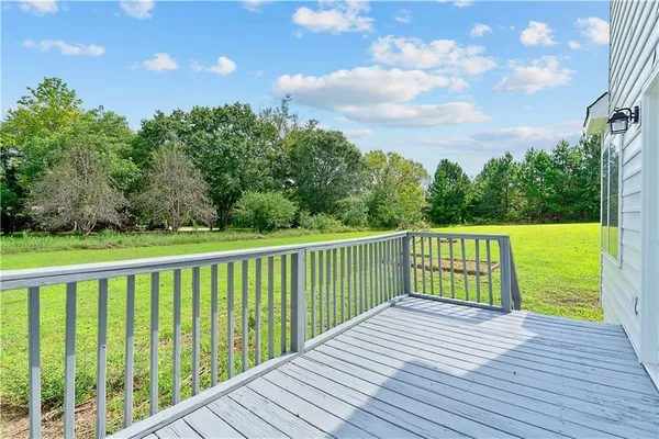 a view of a balcony with wooden floor