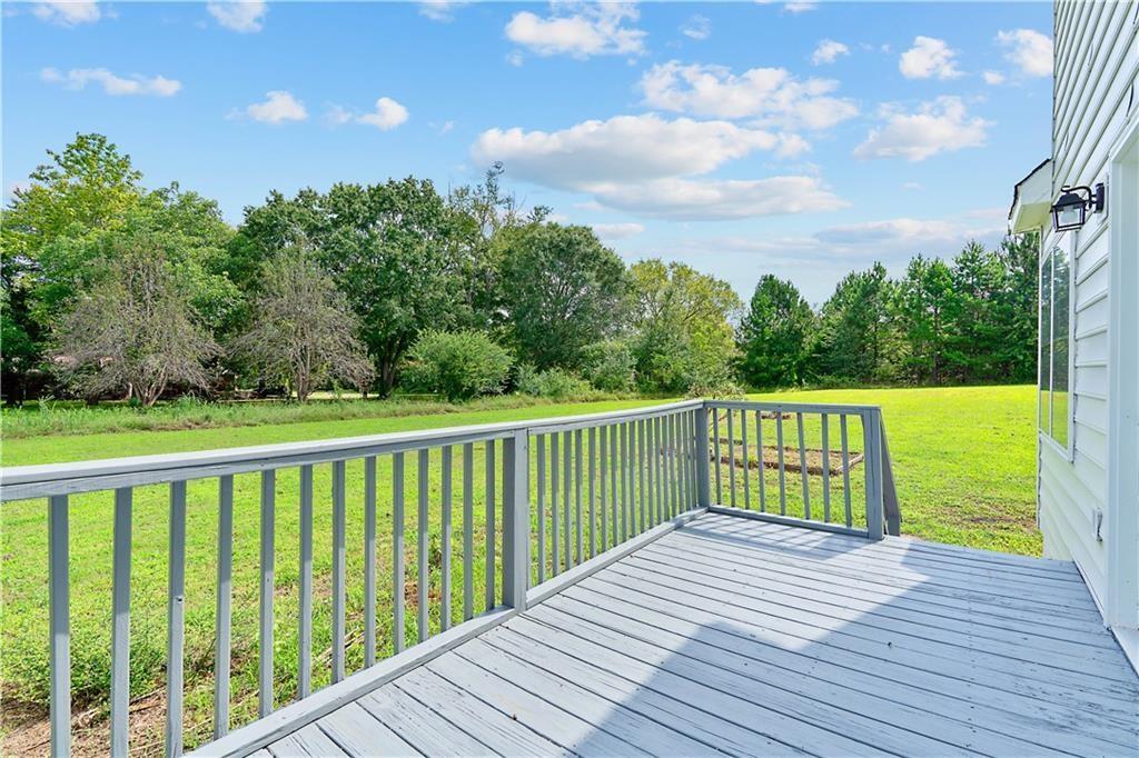 7 Herchel Mize Road Southwest Cave Spring, GA 30124 - Photo 7 of 58 a view of a balcony with wooden floor