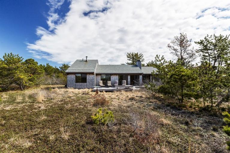 10 Turnstone Road Truro, MA 02666 - Photo 22 of 29 a front view of a house with a yard