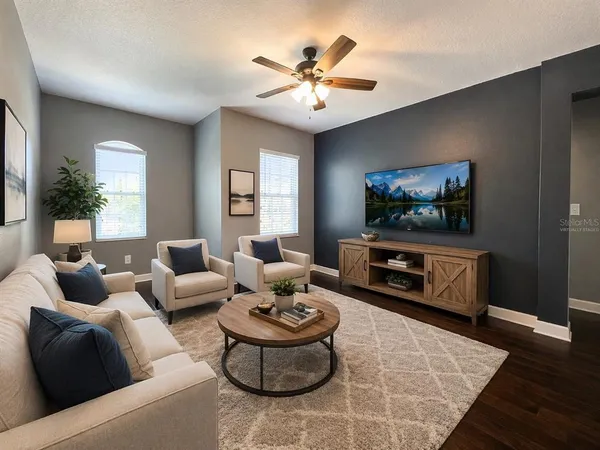a living room with furniture and a flat screen tv