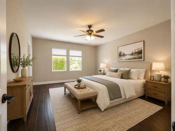 a spacious bedroom with a bed and a chandelier