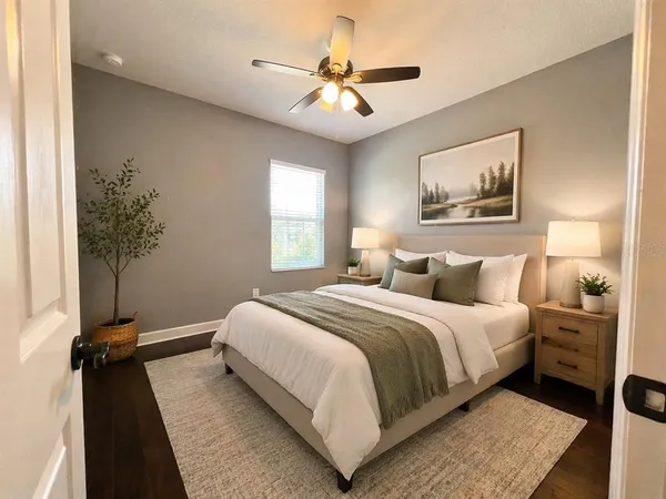 a bedroom with a bed and a window