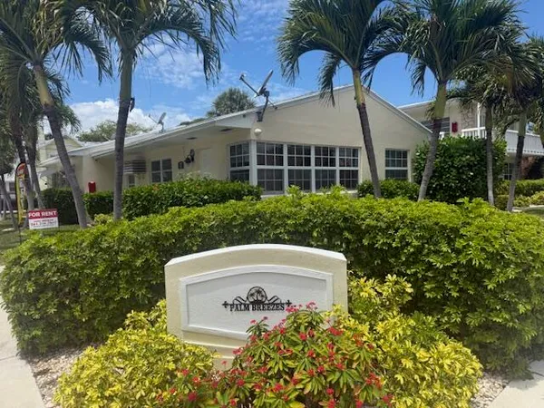 front view of a house with a garden