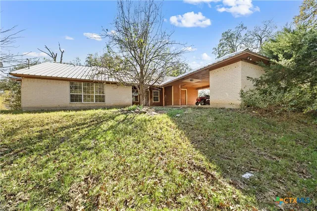 an empty room with furniture and a fireplace