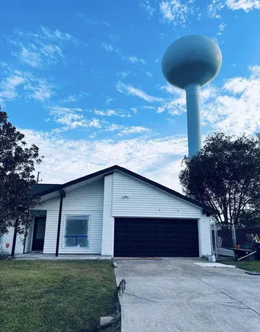 a house view with a garden space