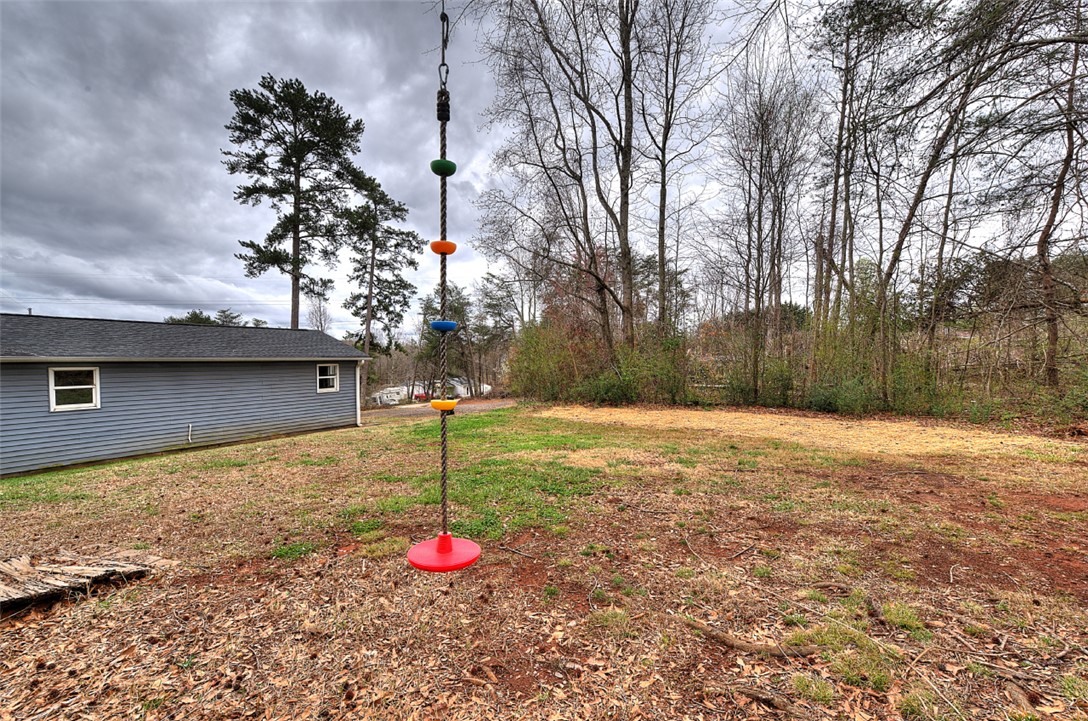 325 Rock Quarry Road Travelers Rest, SC 29690 - Photo 33 of 37 Expansive outdoor space with natural surroundings and ample room for recreation.