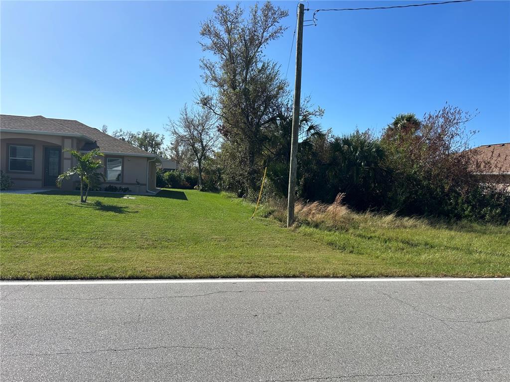 497 Sunset Road North Rotonda West, FL 33947 - Photo 1 of 1 a view of a house with a yard
