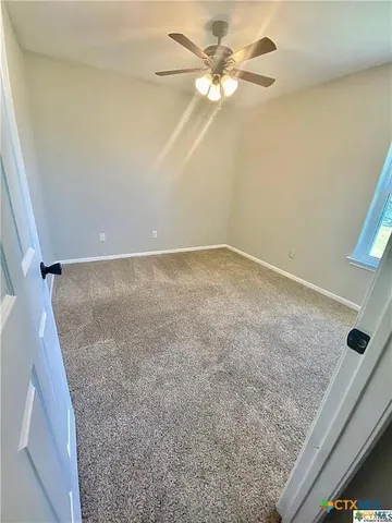 en empty room with fan