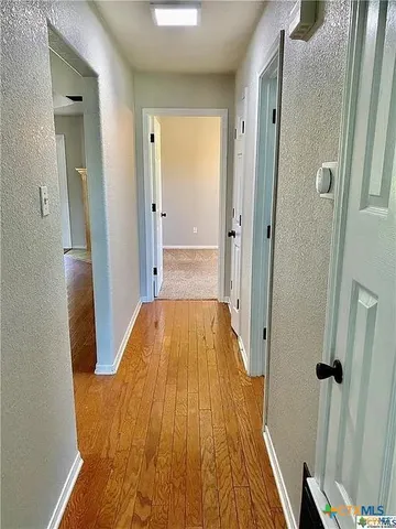 a bathroom with a tub and shower