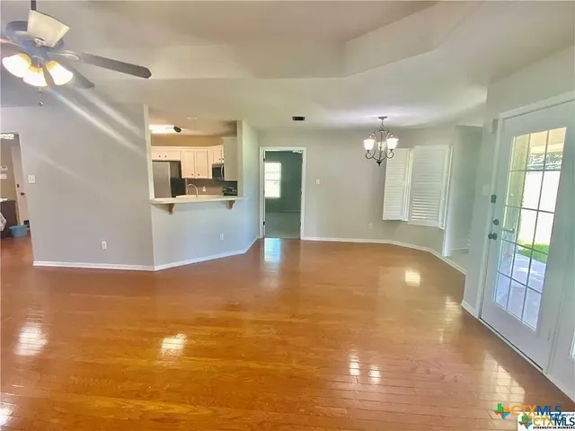 a view of a livingroom with wooden floor