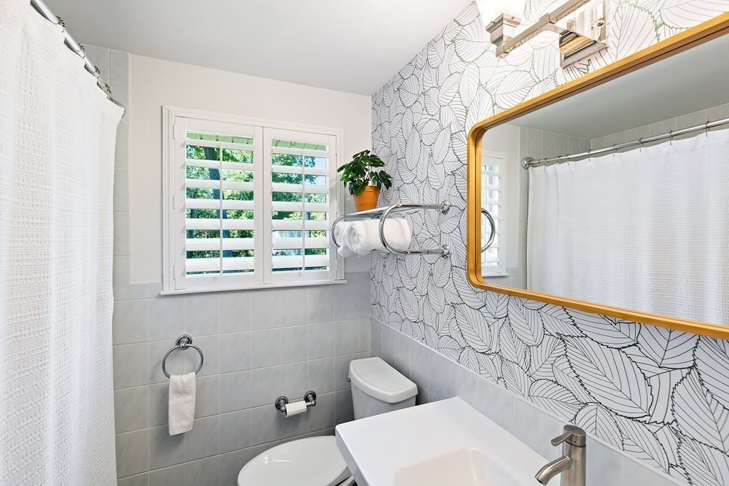 31 Tall Tree Road Sharon, MA 02067 - Photo 15 of 24 a bathroom with a toilet sink and mirror